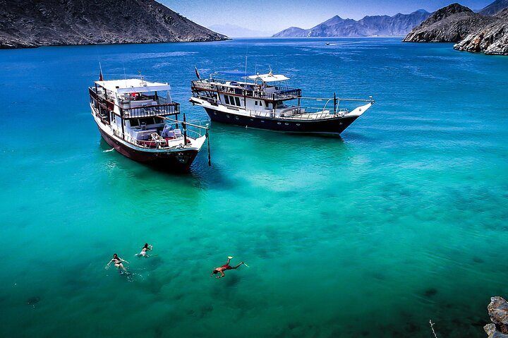 Immerse yourself in the serene beauty of Musandam where tranquil waters meet stunning landscapes perfect for snorkeling adventures and leisurely Dhow Cruise experiences. Capture the essence of nature's wonders.